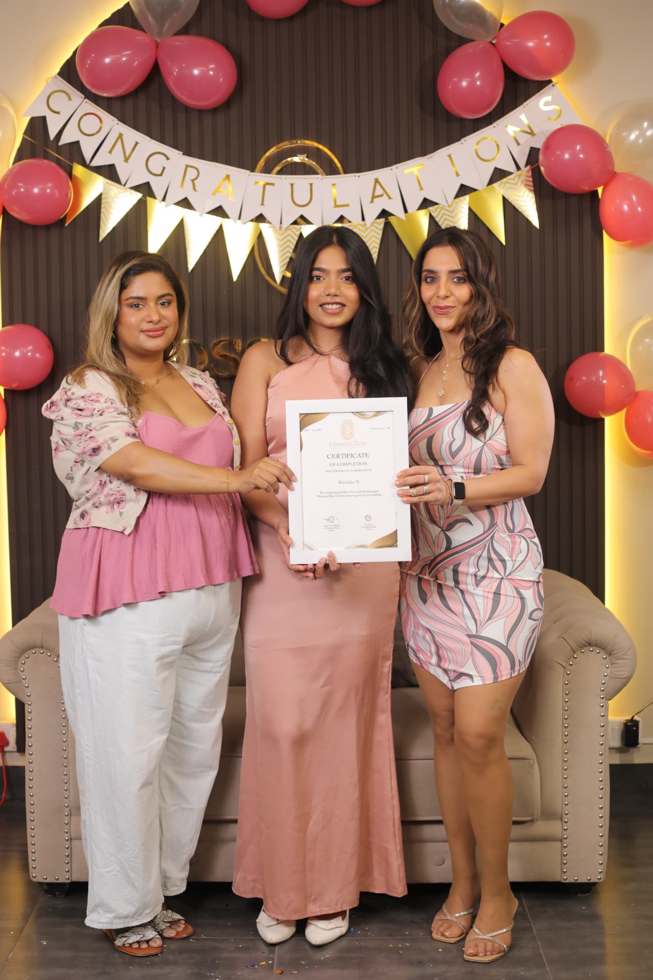 GlossnGlass graduate receiving her completion certificate